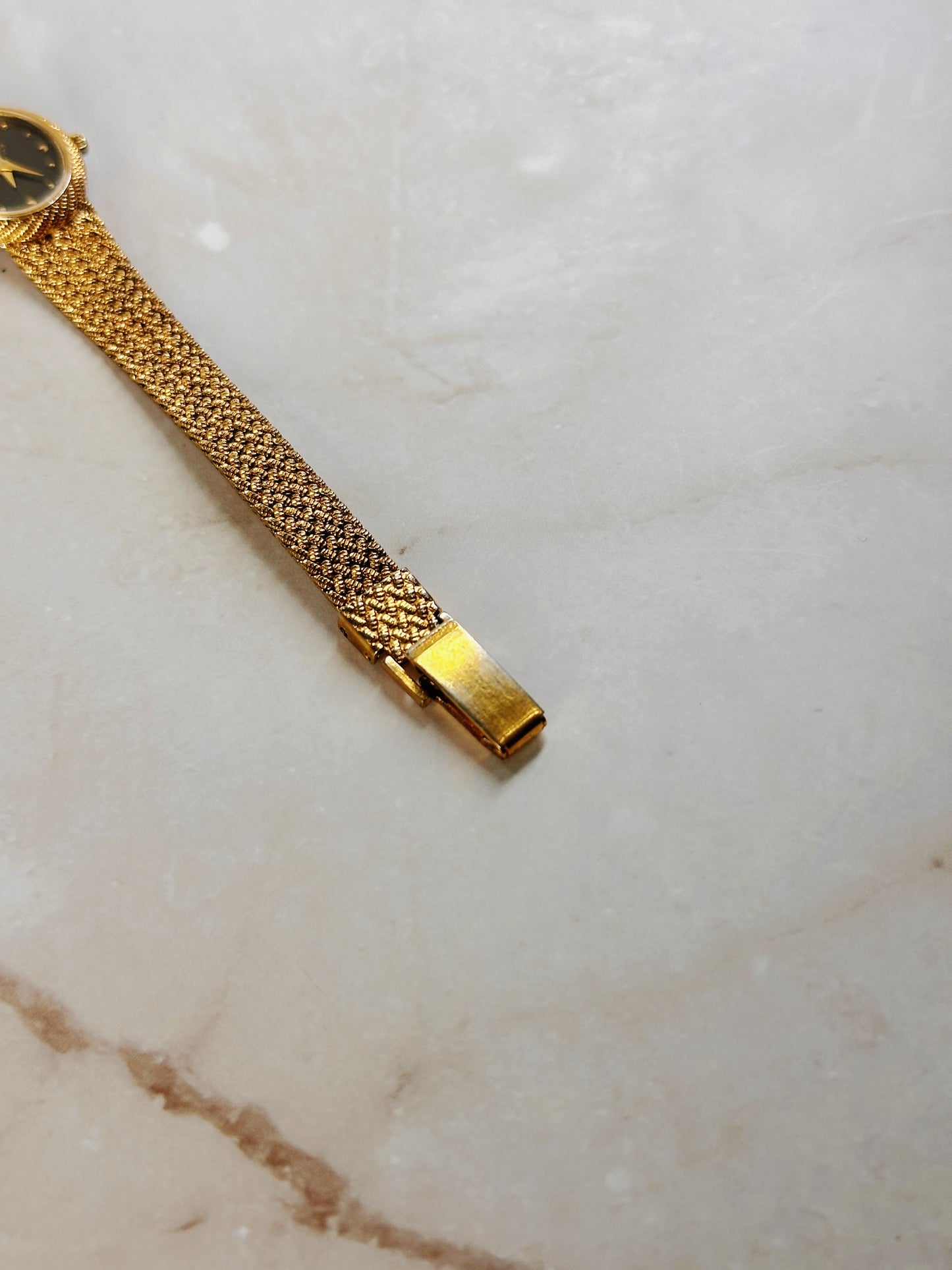 Bulova Petite Oval Gold-Tone Watch – Black Dial – Diamond Accent – Woven Bracelet