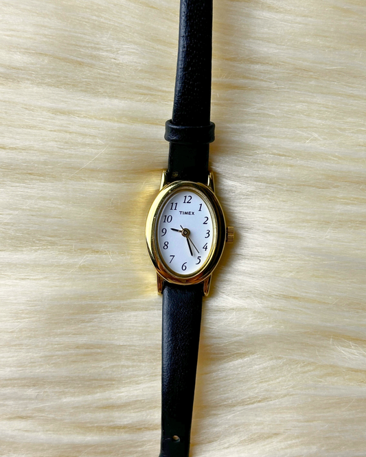Vintage Timex Ladies’ Gold-Tone Oval Quartz Watch – White Dial