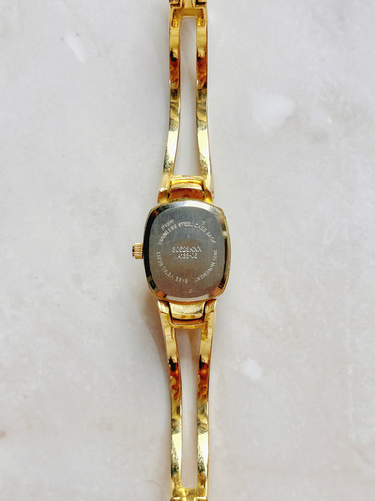 Quartz Dress Watch – Silver Sunburst Dial with Gold-Tone Open Bangle Bracelet (WR 30M)