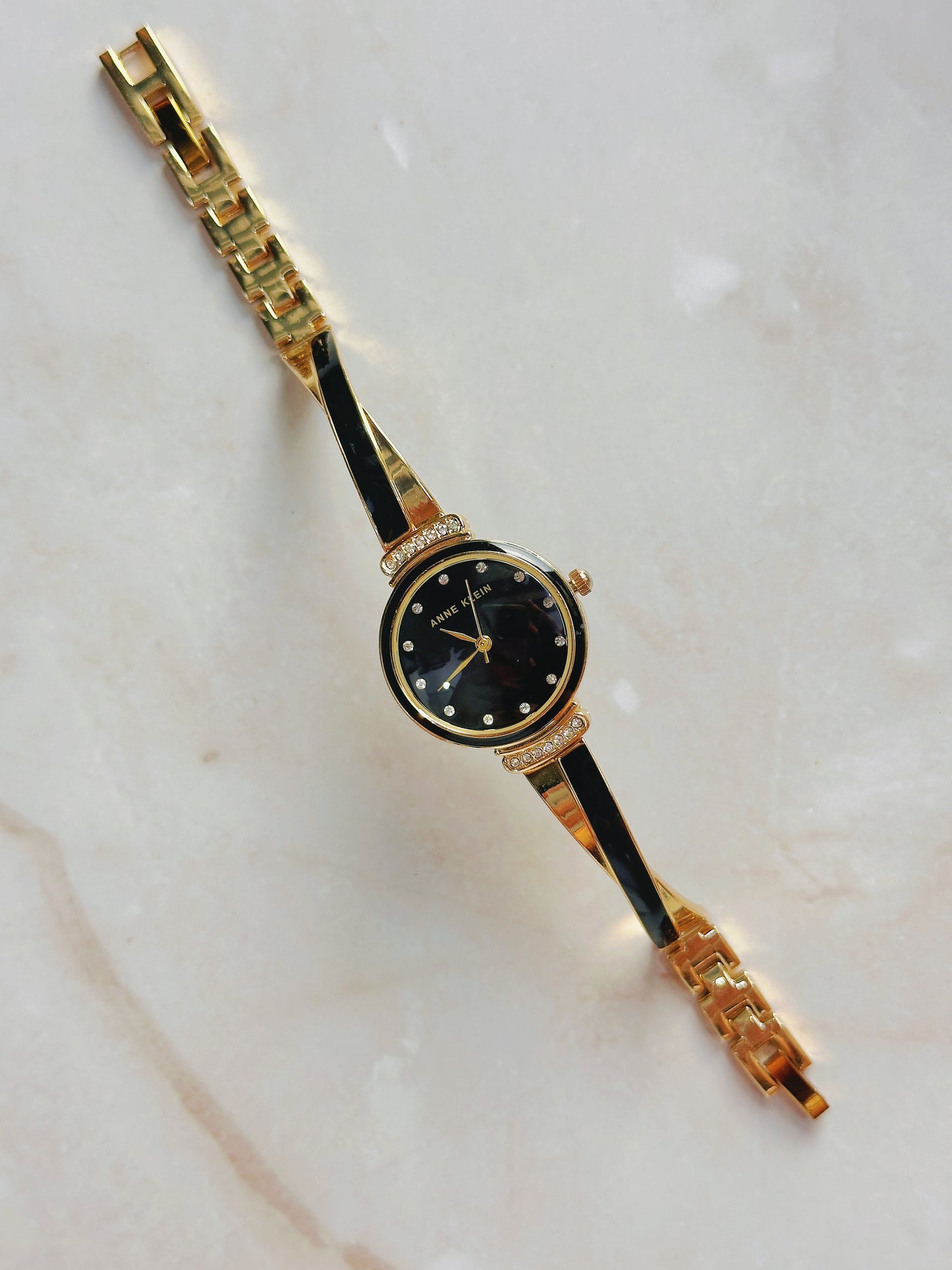 Anne Klein Quartz Watch – Black Dial with Crystal Accents & Gold-Tone Bangle Bracelet (WR 30M)