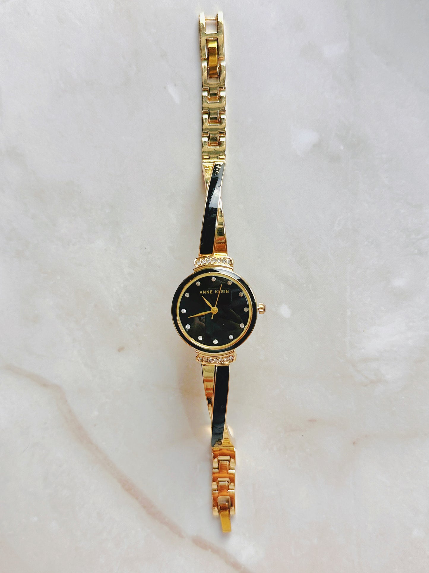 Anne Klein Quartz Watch – Black Dial with Crystal Accents & Gold-Tone Bangle Bracelet (WR 30M)