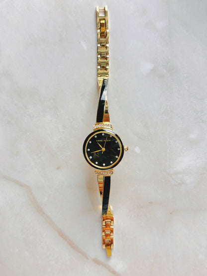 Anne Klein Quartz Watch – Black Dial with Crystal Accents & Gold-Tone Bangle Bracelet (WR 30M)