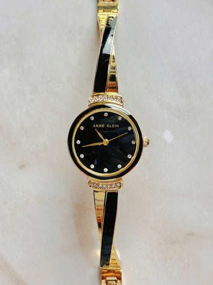 Anne Klein Quartz Watch – Black Dial with Crystal Accents & Gold-Tone Bangle Bracelet (WR 30M)