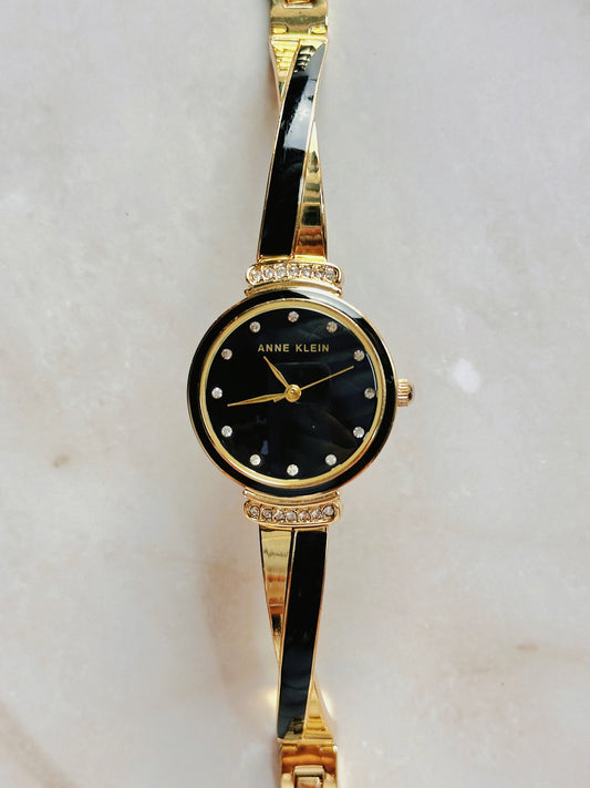Anne Klein Quartz Watch – Black Dial with Crystal Accents & Gold-Tone Bangle Bracelet (WR 30M)