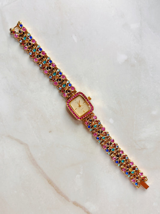 Suzanne Somers Quartz Watch – Gold Dial with Pink Crystal Bezel & Multicolor Gem Bracelet (WR 30M)