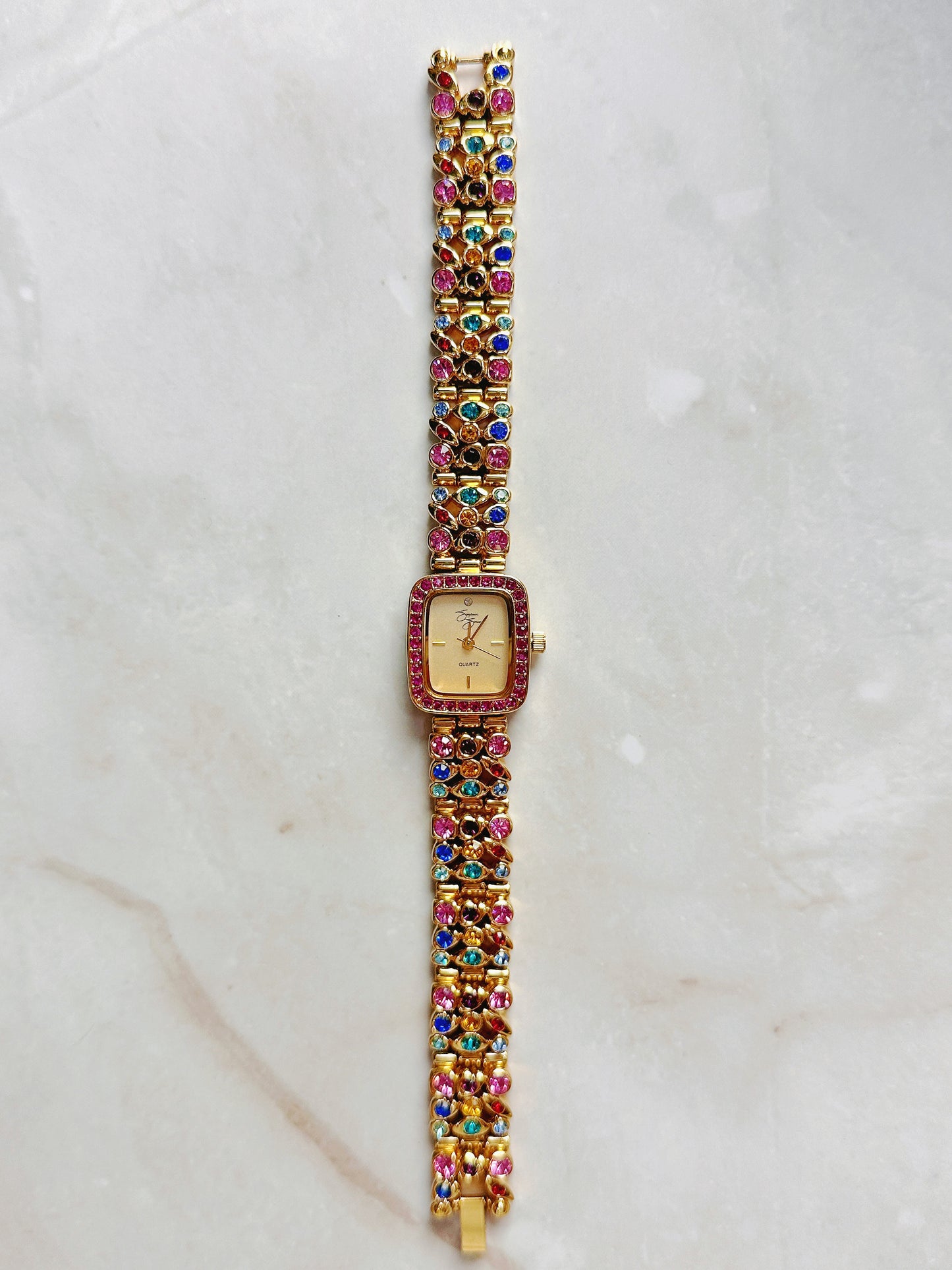 Suzanne Somers Quartz Watch – Gold Dial with Pink Crystal Bezel & Multicolor Gem Bracelet (WR 30M)