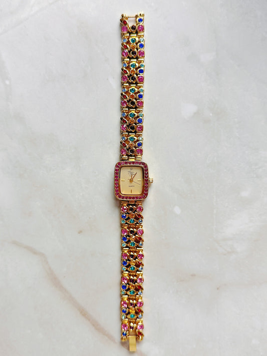 Suzanne Somers Quartz Watch – Gold Dial with Pink Crystal Bezel & Multicolor Gem Bracelet (WR 30M)
