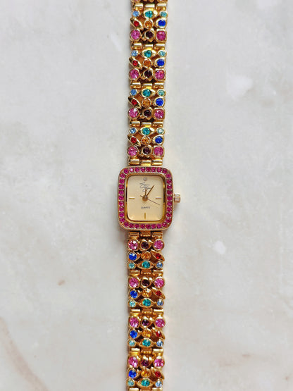 Suzanne Somers Quartz Watch – Gold Dial with Pink Crystal Bezel & Multicolor Gem Bracelet (WR 30M)