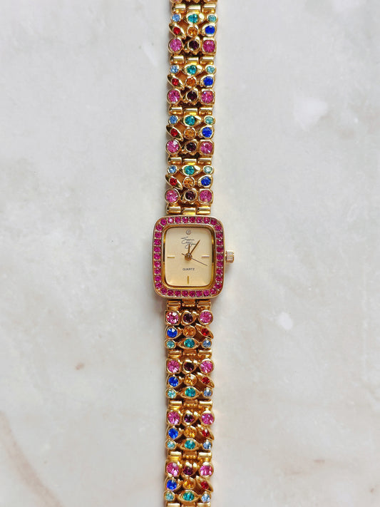 Suzanne Somers Quartz Watch – Gold Dial with Pink Crystal Bezel & Multicolor Gem Bracelet (WR 30M)