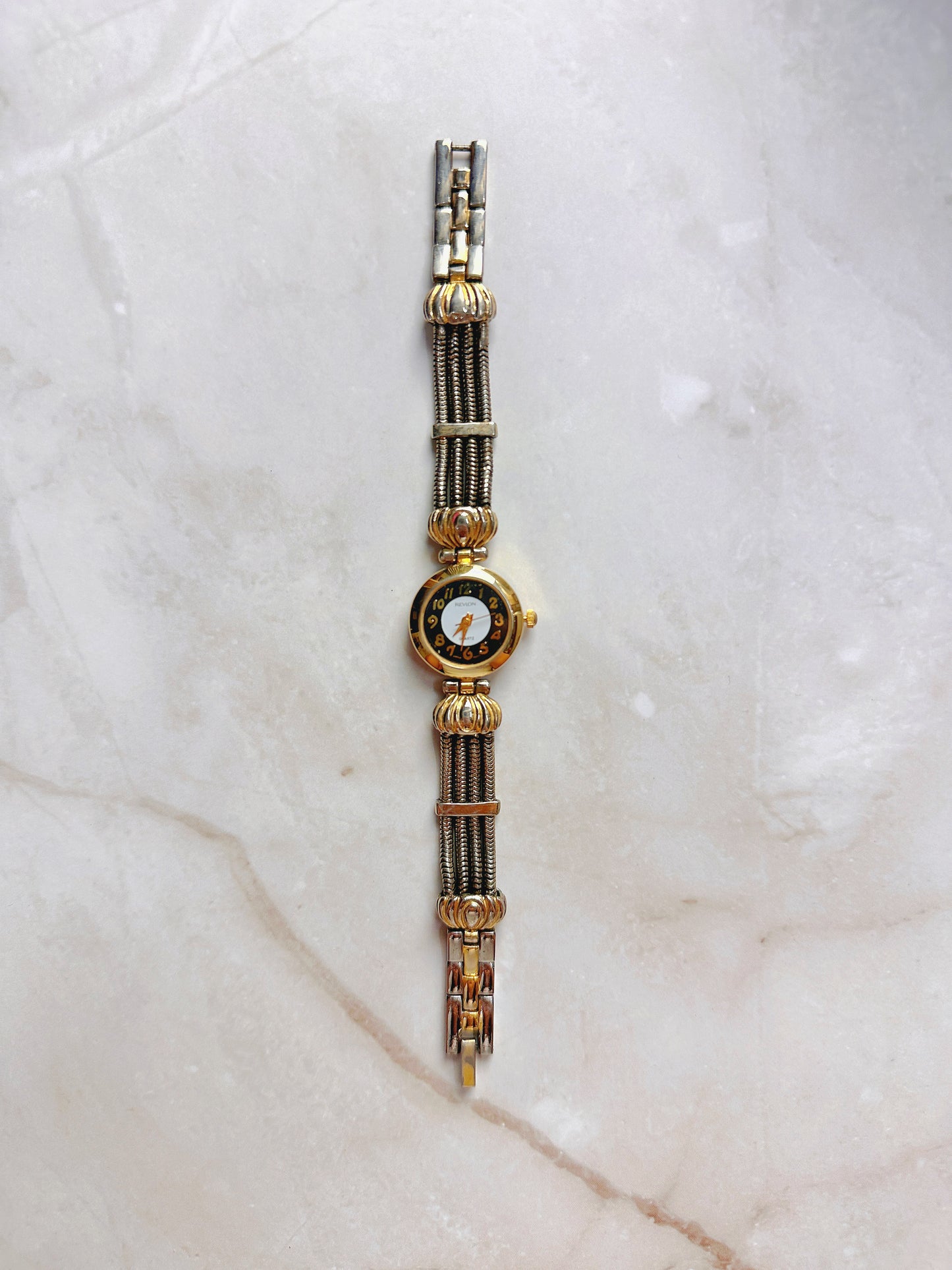 Revlon Quartz Watch – Black & White Dial with Two-Tone Multi-Strand Bracelet (WR 30M)