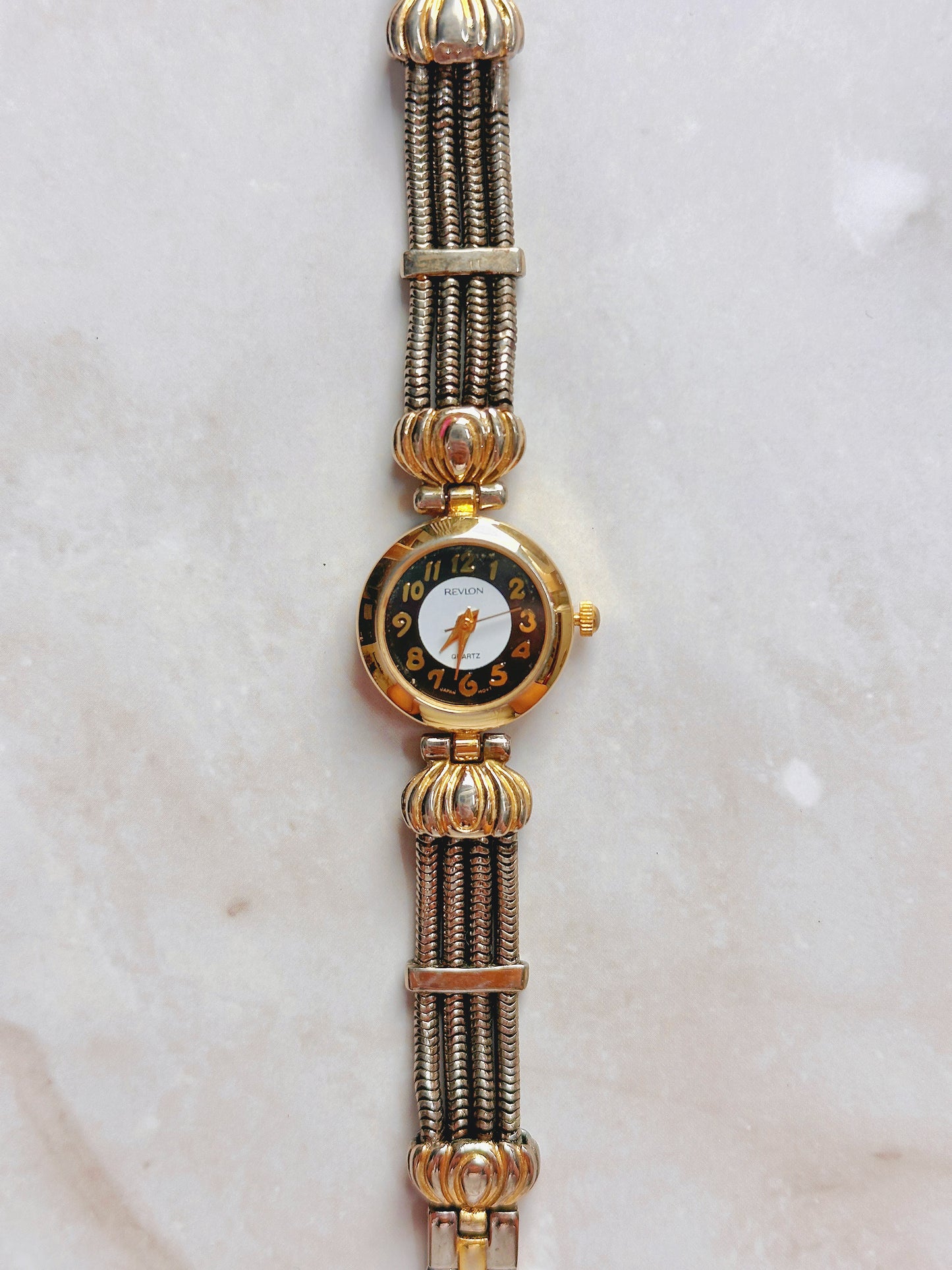 Revlon Quartz Watch – Black & White Dial with Two-Tone Multi-Strand Bracelet (WR 30M)