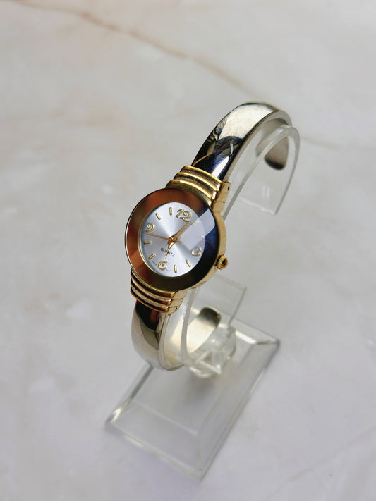 Vintage Quartz Bangle Watch – Gold Tone with Amber-Tone Bezel Accent