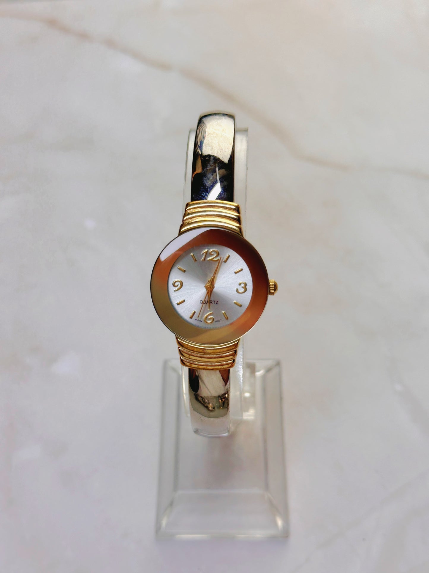 Vintage Quartz Bangle Watch – Gold Tone with Amber-Tone Bezel Accent