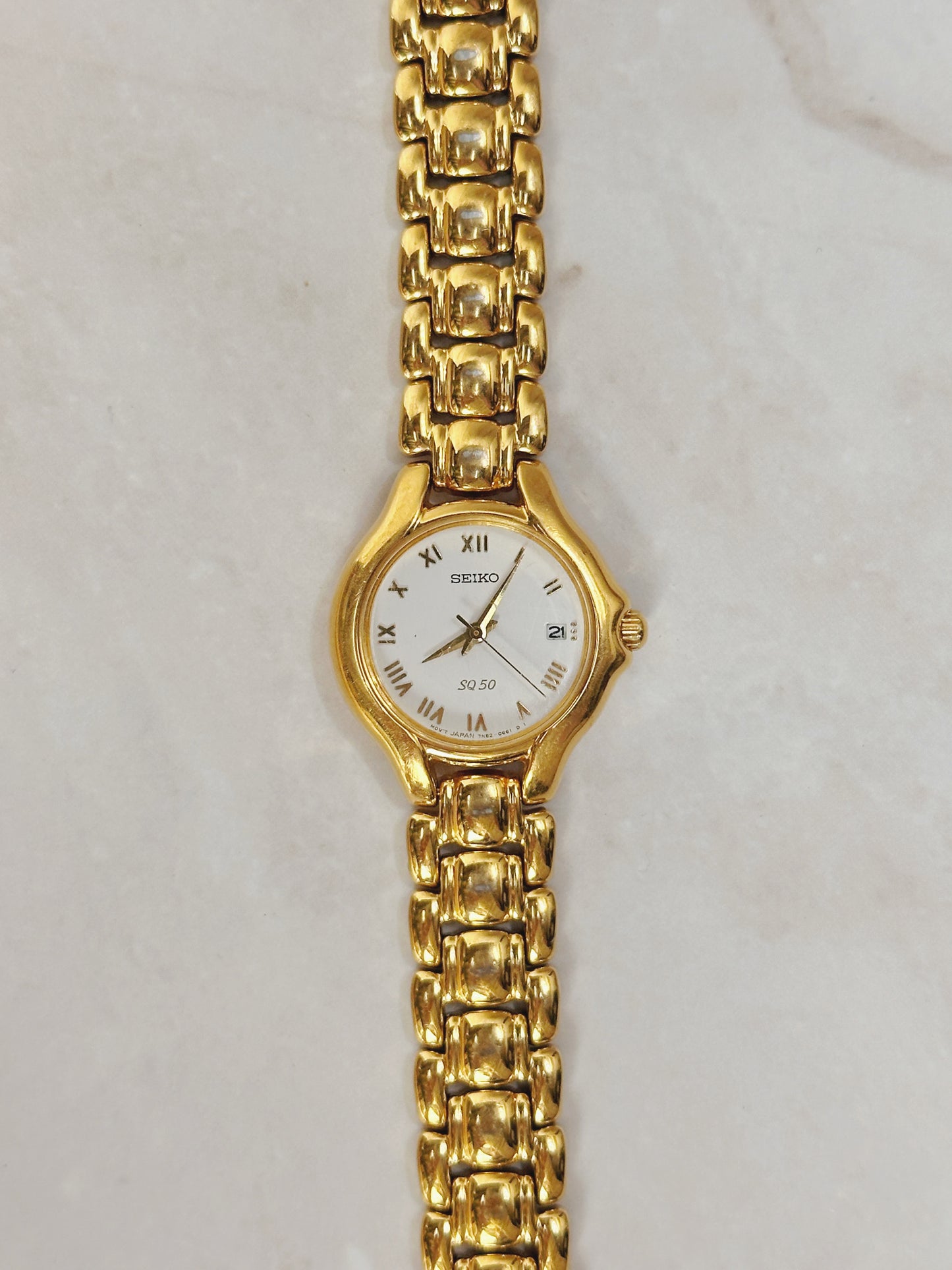 Seiko SQ50 Gold-Tone Date Watch – Roman Numerals – Quartz