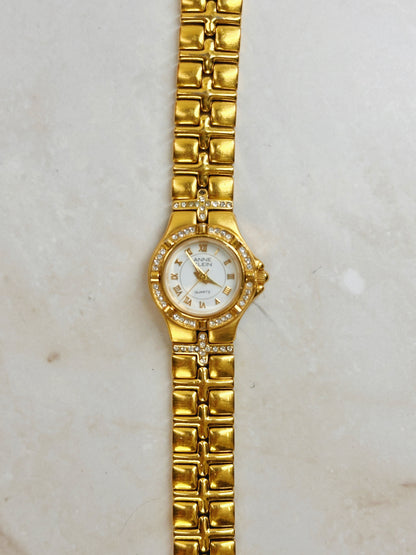 Anne Klein Gold-Tone Crystal Bezel Watch – Roman Numerals – Quartz – Elegant Ladies
