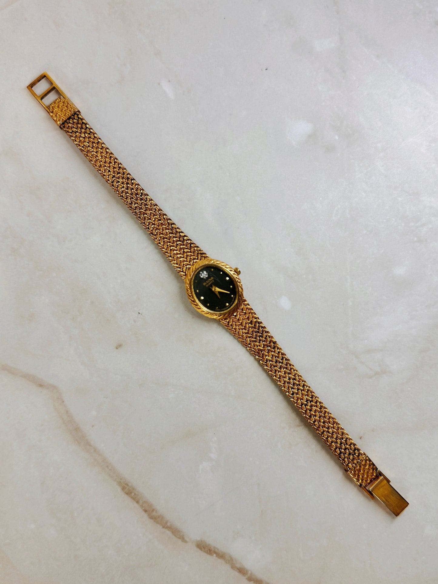 Bulova Petite Oval Gold-Tone Watch – Black Dial – Diamond Accent – Woven Bracelet