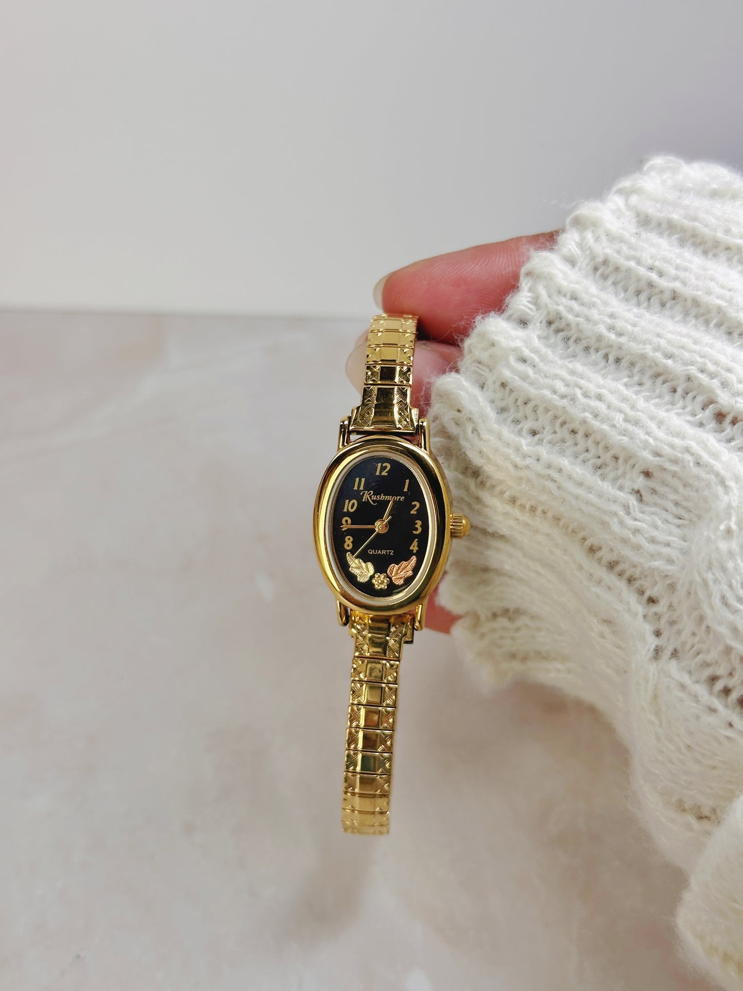 Rushmore Petite Oval Gold-Tone Watch – Black Dial – Floral Accent – Vintage Stretch Bracelet