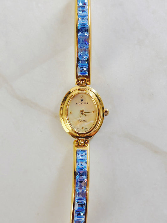 Focus Gold Tone Bracelet Watch – Blue Crystal Accents – Oval Dial – Quartz – New Battery