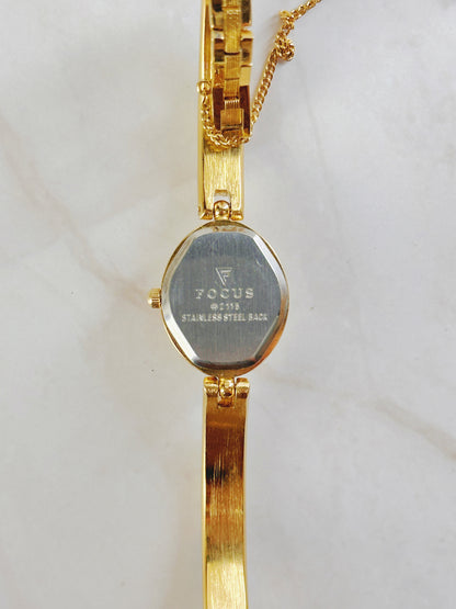 Focus Gold Tone Bracelet Watch – Blue Crystal Accents – Oval Dial – Quartz – New Battery
