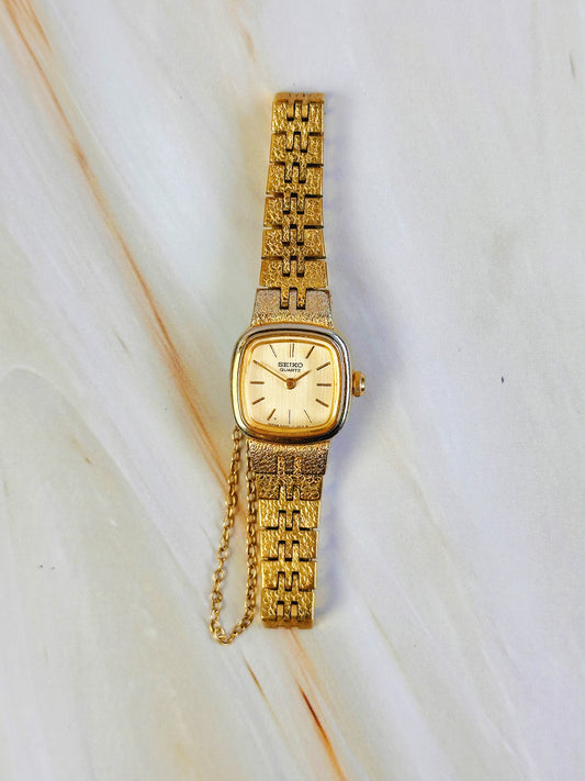 Seiko Women’s Gold Tone Cushion Dress Watch – Vintage Quartz – Integrated Bracelet