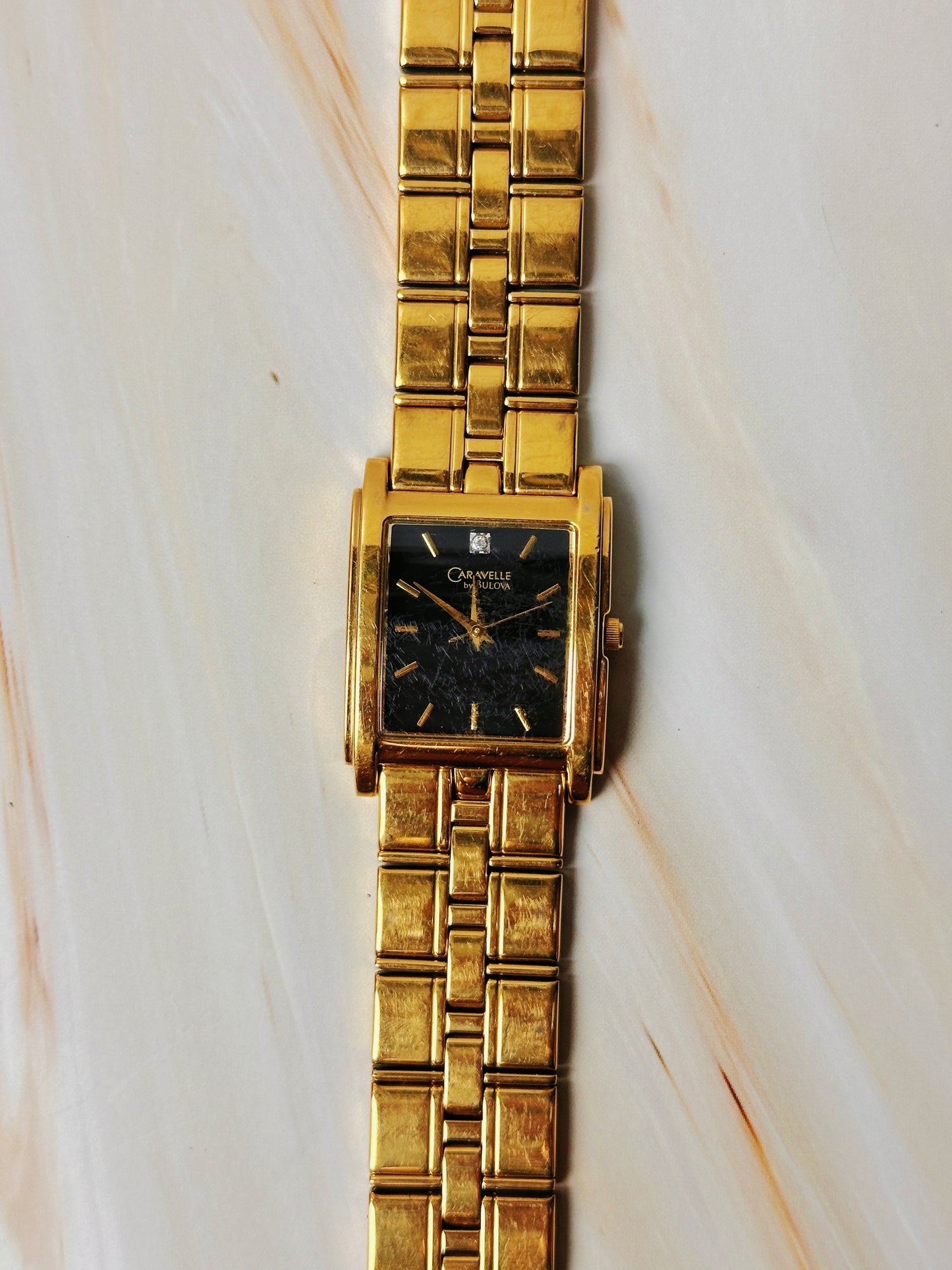 Caravelle by Bulova Women’s Gold Tone Tank Style Watch – Black Dial – Quartz Dress Watch