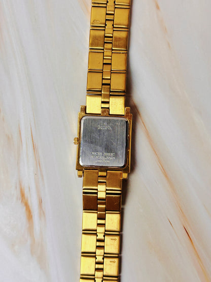 Caravelle by Bulova Women’s Gold Tone Tank Style Watch – Black Dial – Quartz Dress Watch