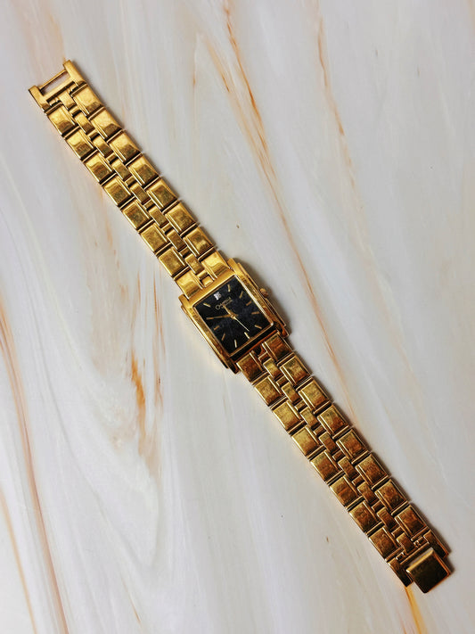 Caravelle by Bulova Women’s Gold Tone Tank Style Watch – Black Dial – Quartz Dress Watch