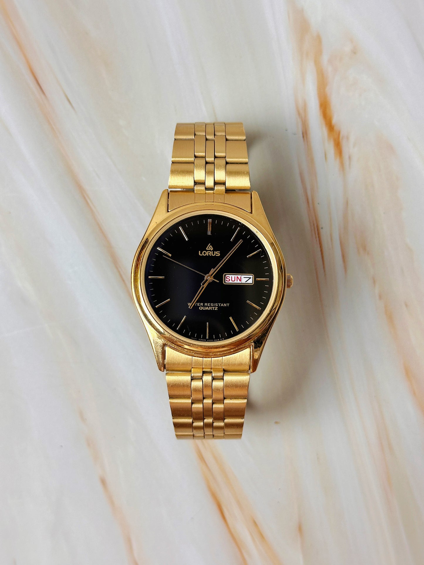 Lorus Quartz Men’s Watch – Day Date – Black Dial – Gold Tone Bracelet – Water Resistant